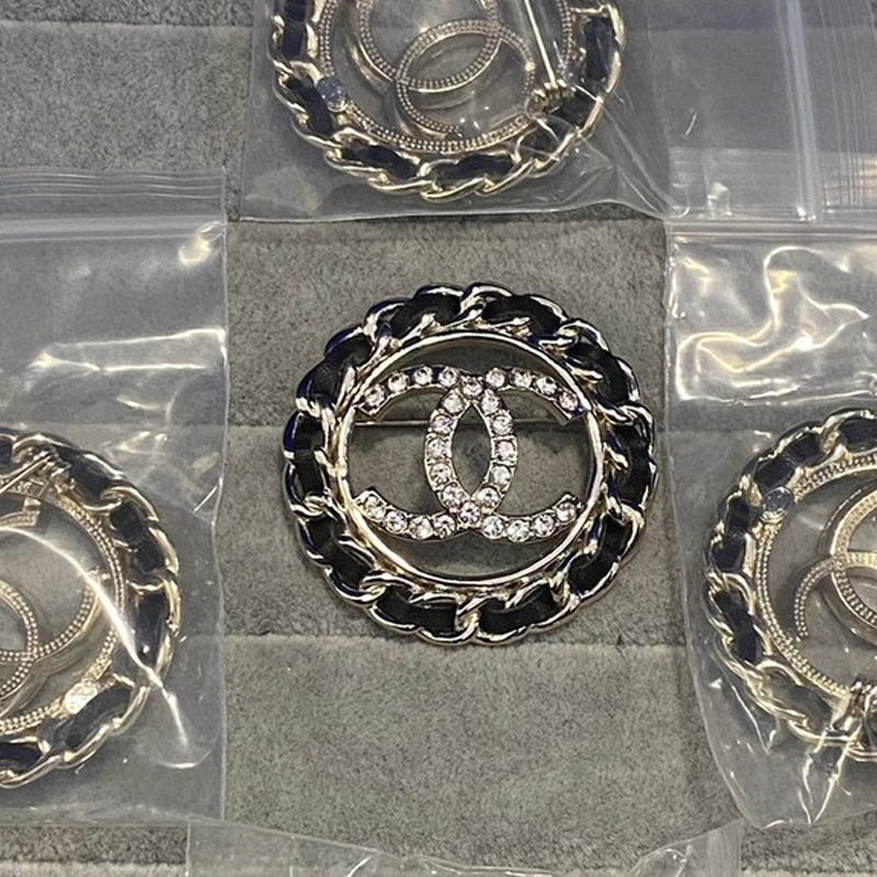 CC Leather Diamond Round Brooch