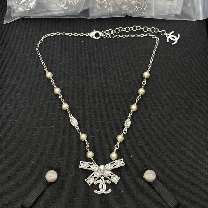 CC Bow Tie Diamond Gold Necklace