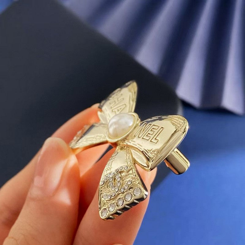 CC Bow Tie Gold Brooch