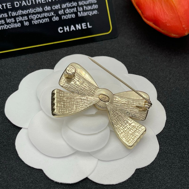 CC Bow Tie Gold Brooch
