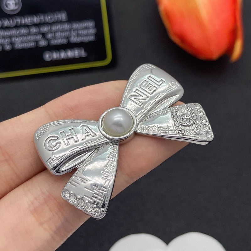 CC Bow Tie Gold Brooch