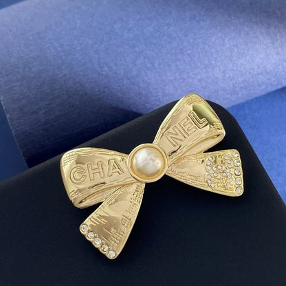 CC Bow Tie Gold Brooch