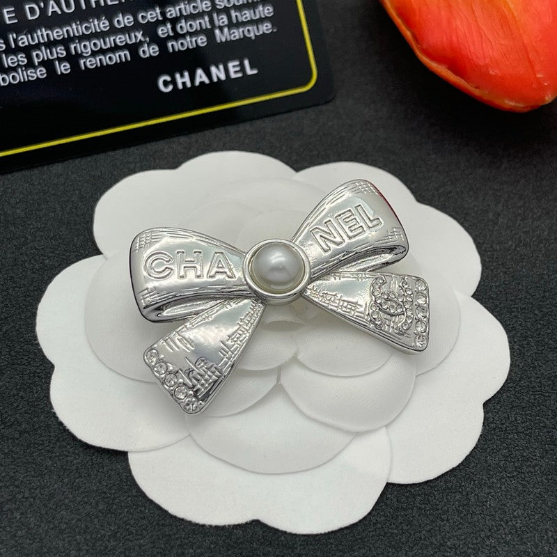 CC Bow Tie Gold Brooch