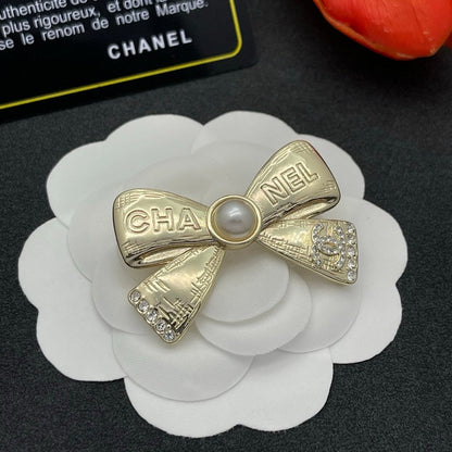 CC Bow Tie Gold Brooch