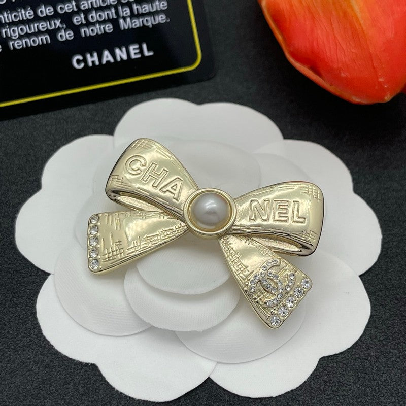 CC Bow Tie Gold Brooch