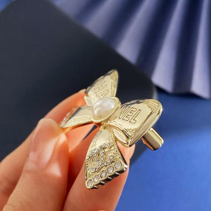 CC Bow Tie Gold Brooch