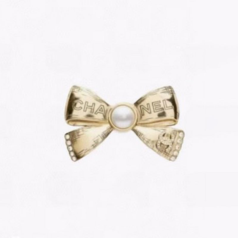 CC Bow Tie Gold Brooch