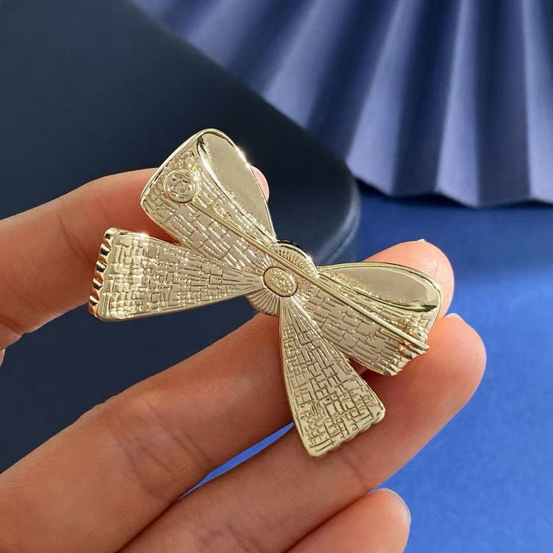 CC Bow Tie Gold Brooch